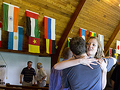 Laura Newby greets a fellow congregant