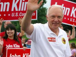 Republican Congressman John Kline campaigns during the Strawberry Festival in Cottage Grove, Minn., Saturday June 16, 2012.