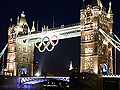 The Olympic rings hang from Tower Bridge