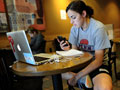 Woman on smartphone, laptop