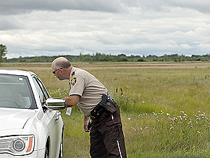 Chief deputy Karl Erickson checks on a motorist