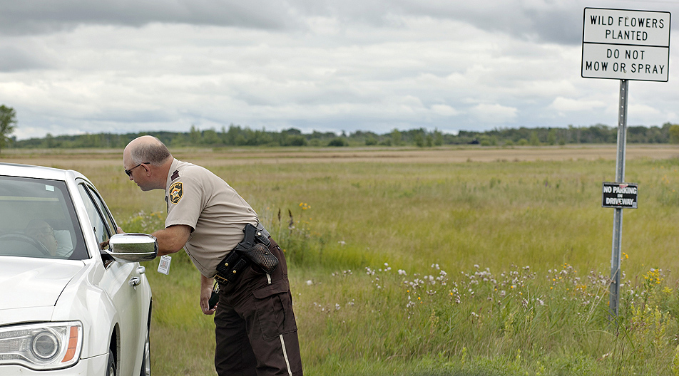 Chief deputy Karl Erickson checks on a motorist