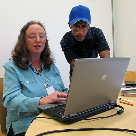 Nancy Cohen, an employment support consultant for at the Minneapolis Workforce Center run by Goodwill-Easter Seals, helps Marcus Cook, Sept. 5, 2012, at the Hennepin County Central Library in downtown Minneapolis. Cook, 47, is a recent transplant from Chicago. He came here looking for work in the restaurant and hospitality industry.
