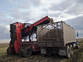 Harvester and truck