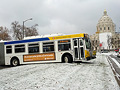Bus astraddle street near Capitol