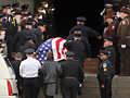 Casket carried into church