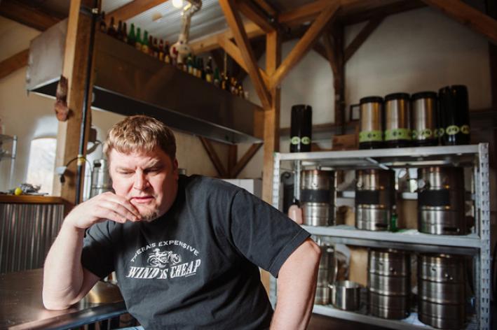 Ken Thiemann sits in the brewery he built. Ken Thiemann sits in the brewery he built.