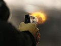 Brett Nielsen fires an Glock handgun