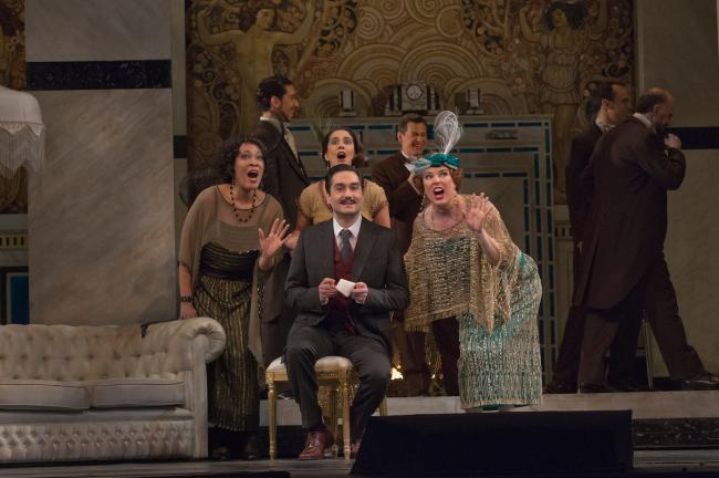 A scene from Puccini's Giuseppe Filianoti (center) as Ruggero with Janinah Burnett as Bianca, Monica Yunus as Yvette, and Margaret Thompson as Suzy in Puccini's "La Rondine." (Ken Howard/Metropolitan Opera)