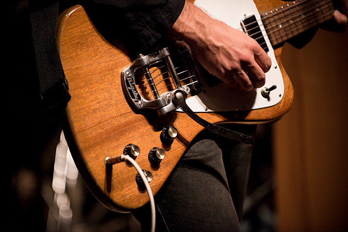 A close-up look at the body of Bryce Dessner's 1965 Gibson Firebird, taken during The National's live performance in the UBS Forum at Minnesota Public Radio. A close-up look at the body of Bryce Dessner's 1965 Gibson Firebird, taken during The National's live performance in the UBS Forum at Minnesota Public Radio.