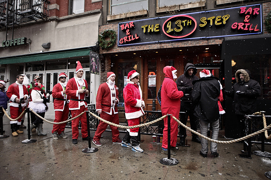 Photos Santas party in New York City at 'SantaCon' bar crawl