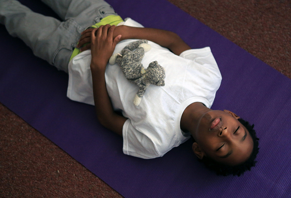Yoga, black labs help open doors at school for troubled kids