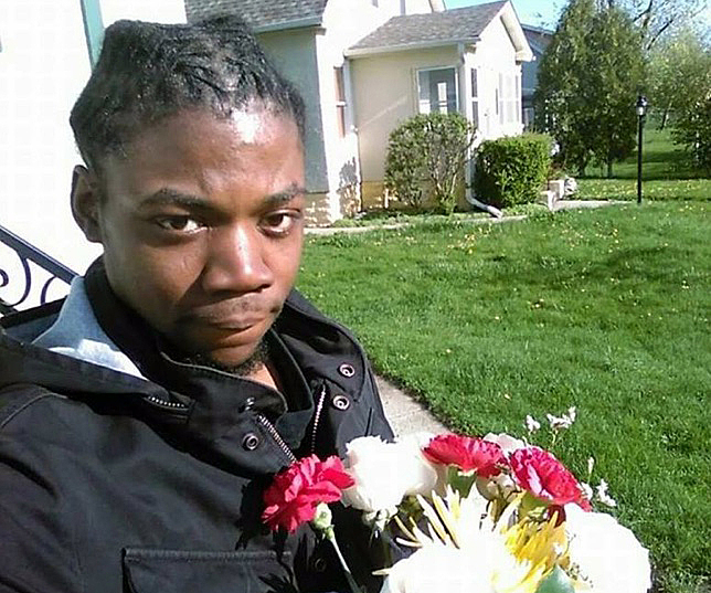 Jamar Clark holds flowers in an undated photo. Clark was fatally shot by Minneapolis police.