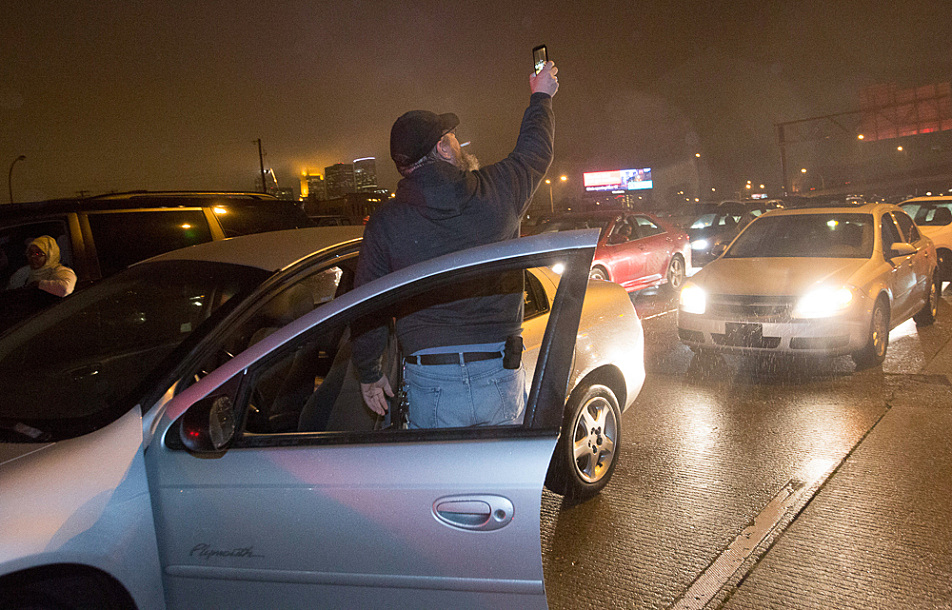 As traffic came to a standstill on Interstate 94 westbound Monday night, one driver got out of his car to take a photo with his cellphone to pass the time.