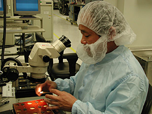 A technician works on a defibrillator at Guidant's manufacturing facility in Arden Hills