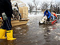 Brad Abel takes a boat to monitor pumps in Oakport